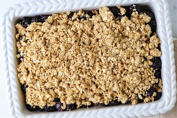 blackberry crisp in a baking dish before baking