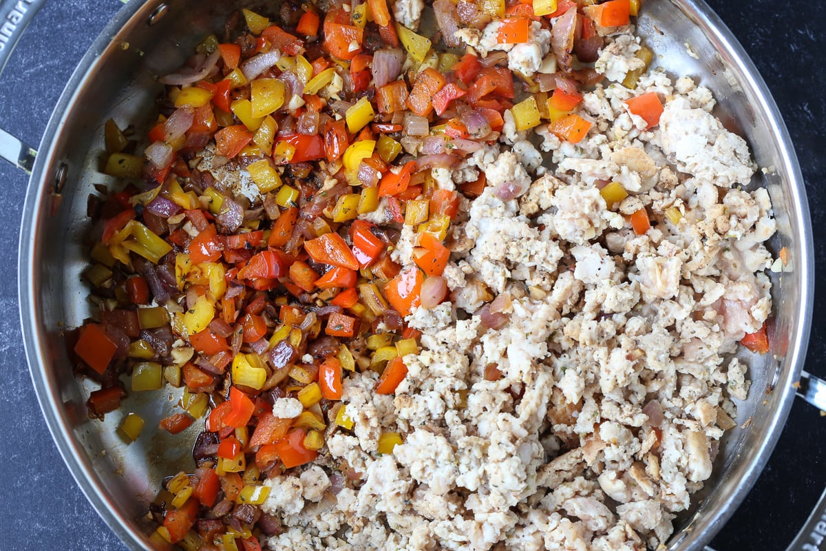 ground turkey, tomatoes and vegetables in a skillet