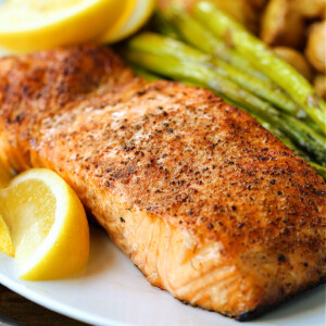 salmon filet on plate with vegetables