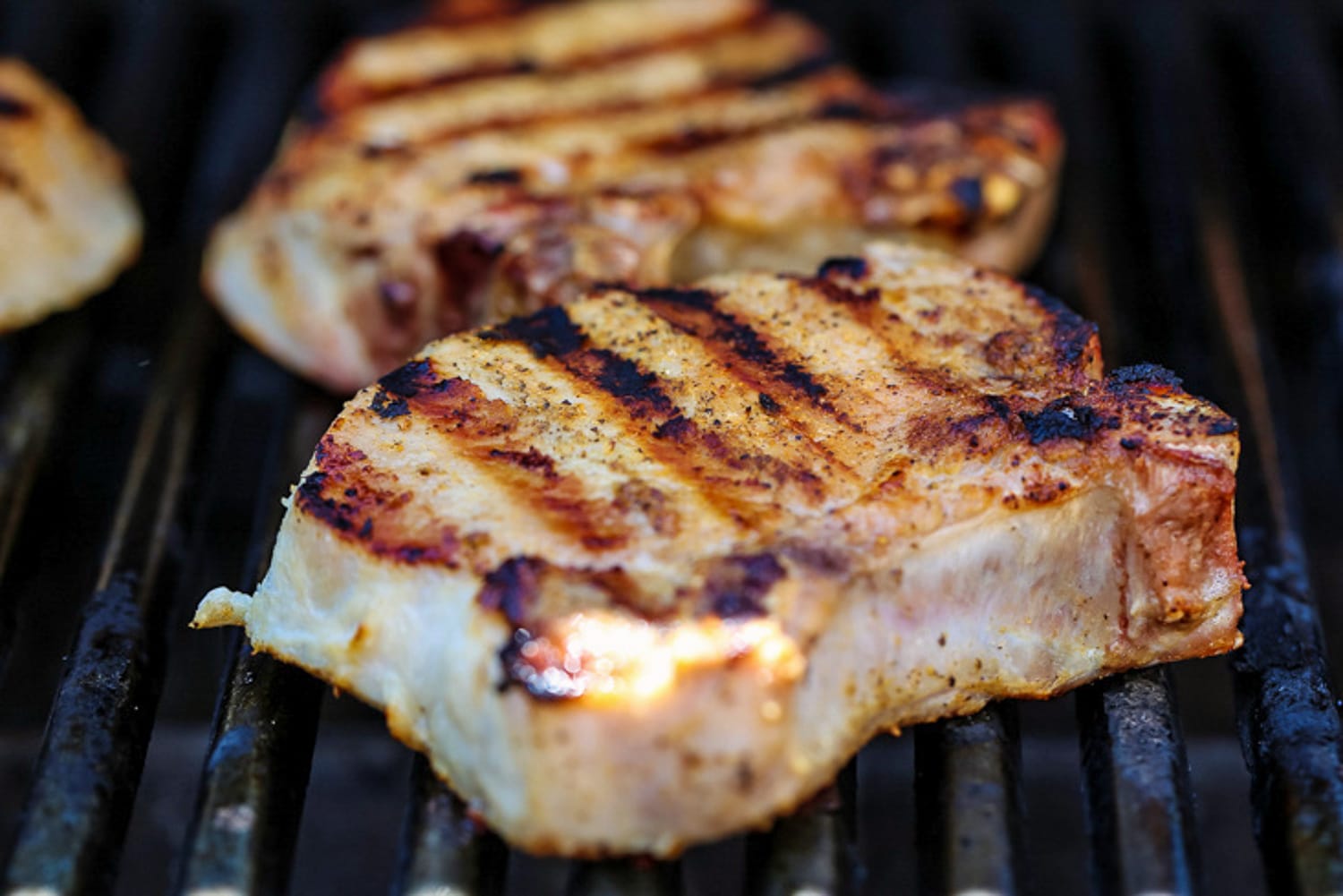 pork chops on the grill with grill marks