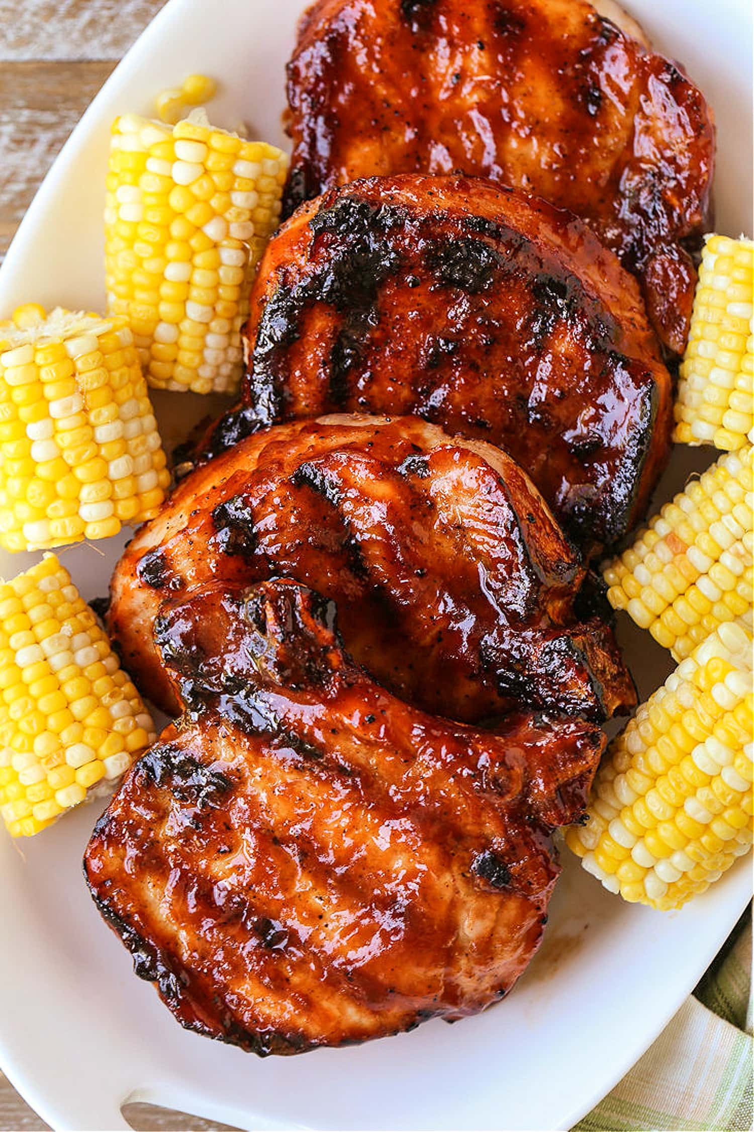 bbq pork chops stacked on a platter