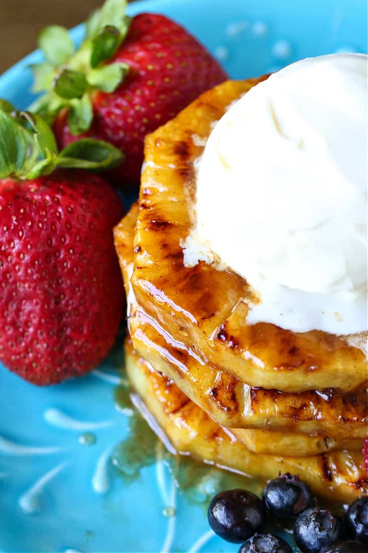 grilled pineapple stacked with ice cream on top