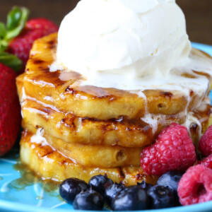 grilled pineapple on blue plate with ice cream