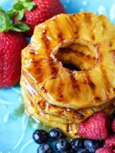 grilled pineapple with berries on the side