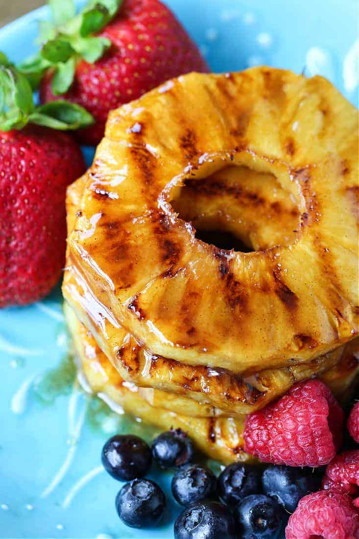 grilled pineapple with berries on the side