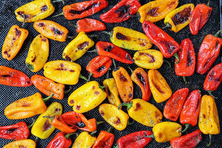 roasted mini peppers on a baking sheet