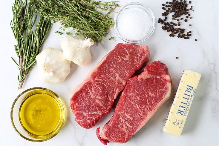 This New York Strip Steak recipe tastes as good as your favorite steak house! Tender, juicy steak made with fresh herbs, garlic and butter! ingredients to make new york strip steak