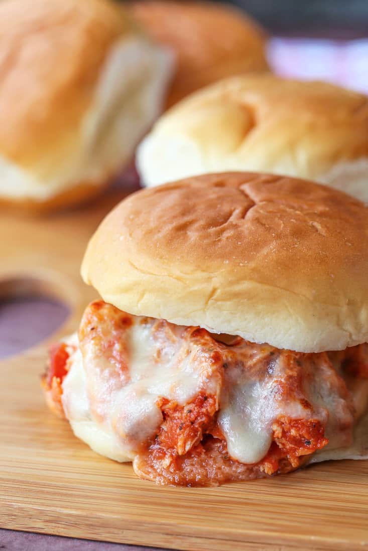 Shredded Chicken parmesan sandwich on a board