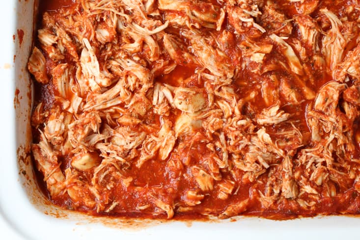 Shredded chicken with sauce in a slow cooker