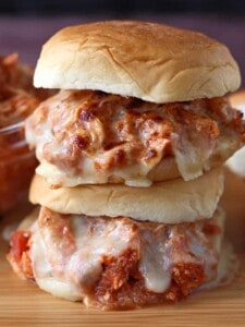 Shredded chicken with sauce and cheese on buns