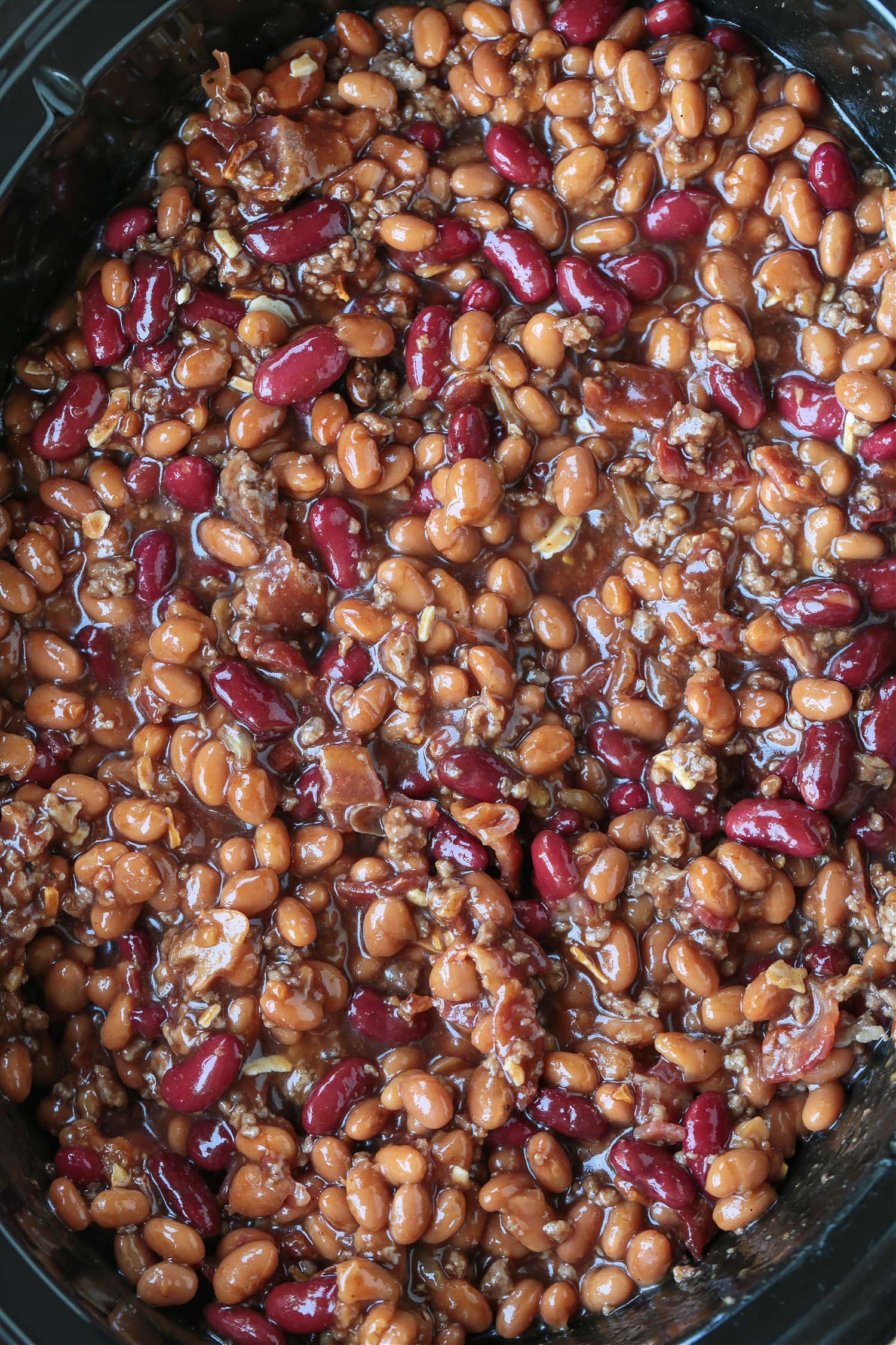 baked beans in a slow cooker with ground beef and bacon