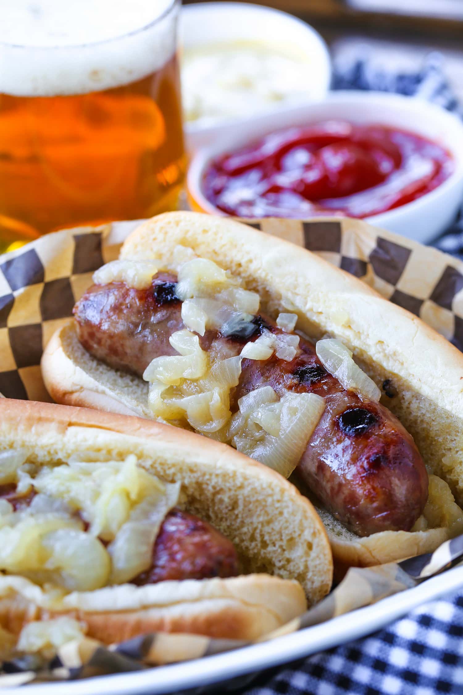 beer brats in a basket with beer on the side
