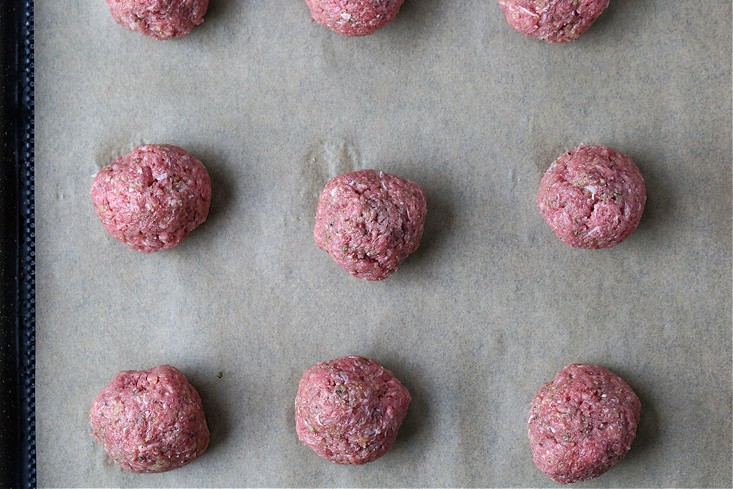 meatballs on a baking sheet for making meatball subs