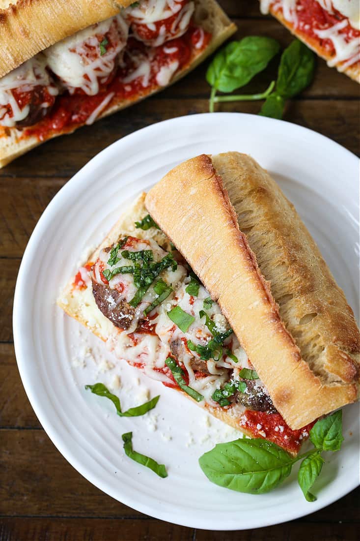 meatball sub on a plate with subs in the background