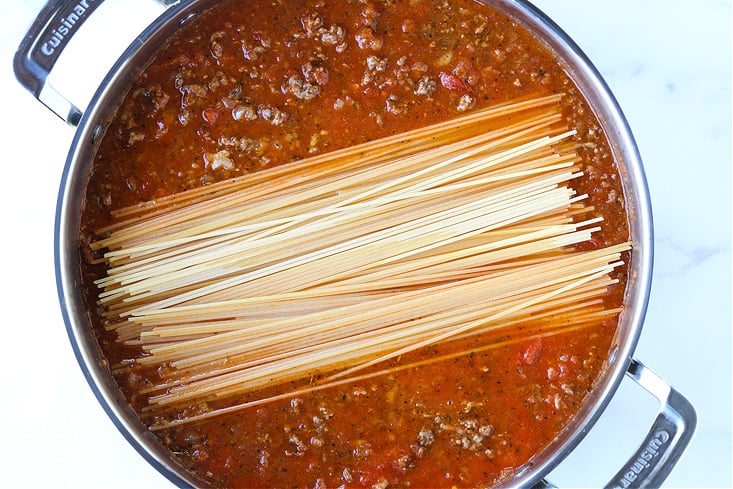 Spaghetti in a pot with ground beef and sauce