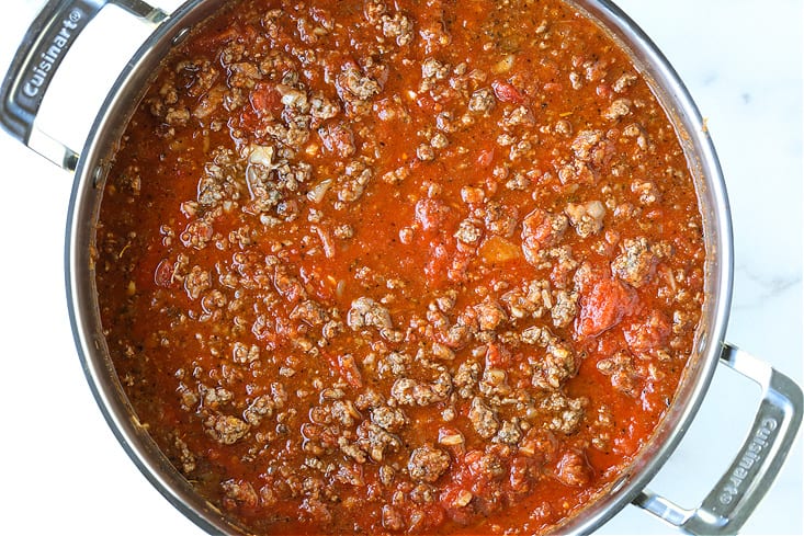 Ground beef and sauce in a pot for spaghetti recipe
