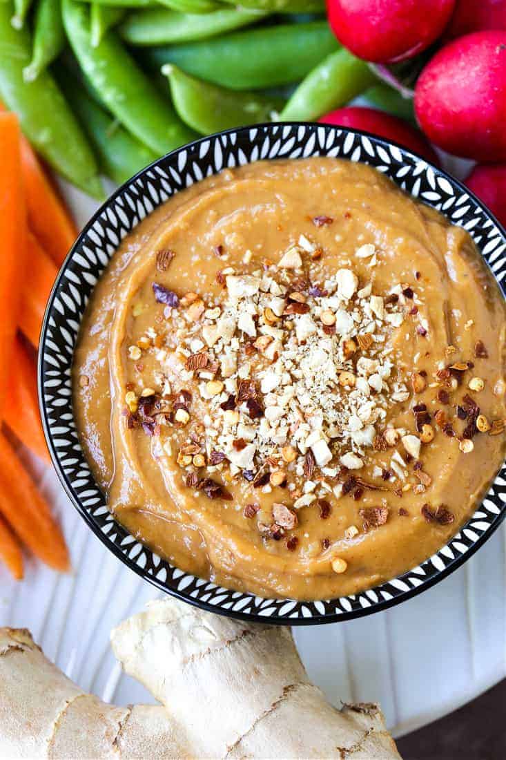 This is our go-to Peanut Sauce Recipe for using in many different recipes! A creamy, savory dip for veggies, a sauce for pasta or salads, or a drizzle over chicken or steak! Peanut sauce with crushed peanuts on top