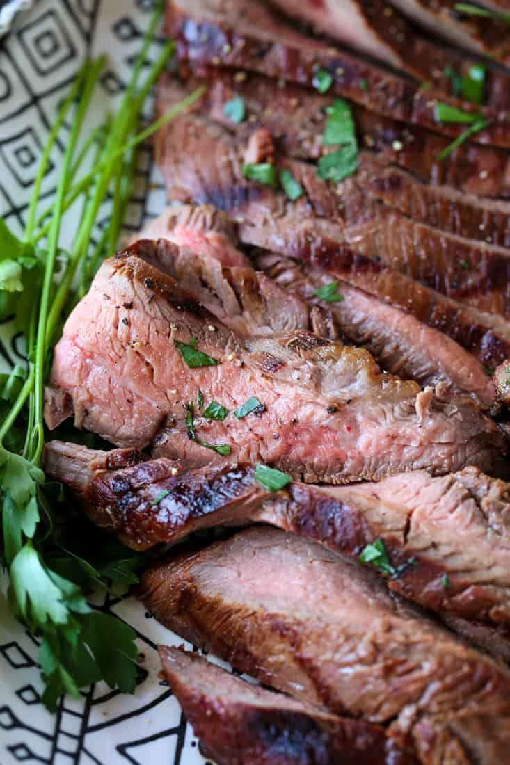 close up of medium rare sliced flank steak