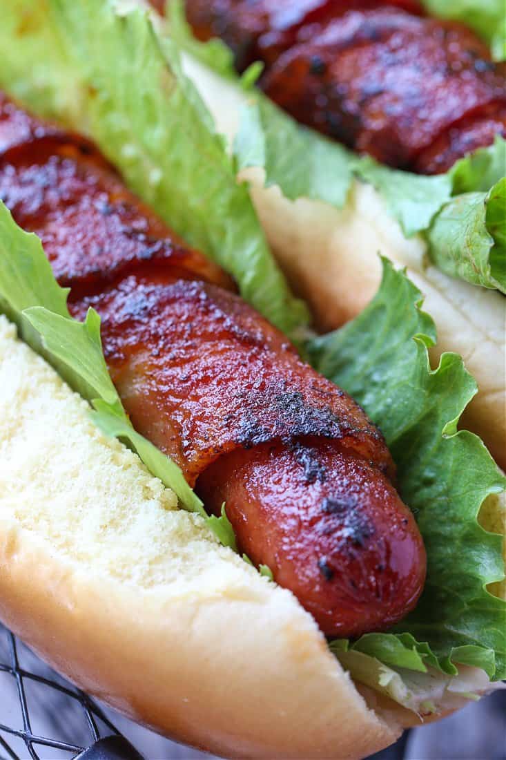 hot dog wrapped with bacon in a bun