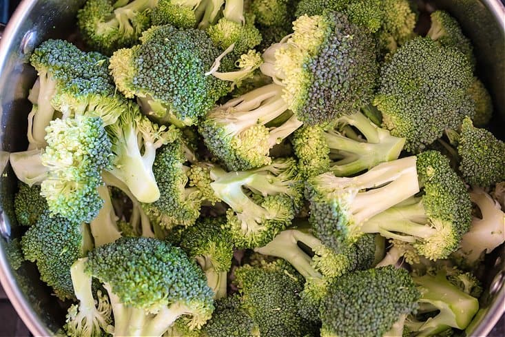 Chopped broccoli in a pot for making soup