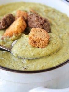 cream of broccoli soup with a spoon and croutons