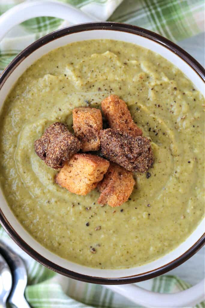 cream of broccoli soup in a bowl with croutons