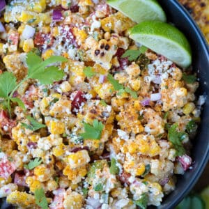 corn salad with mayo dressing in a black bowl