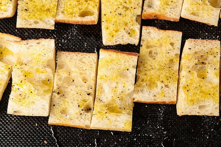 ciabatta bread brushed with olive oil and seasoned with salt and pepper