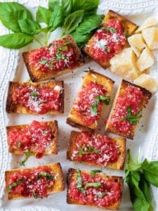 A platter with pan con tomate appetizers