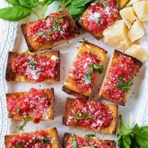 A platter with pan con tomate appetizers