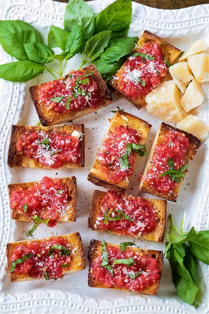 A platter with pan con tomate appetizers