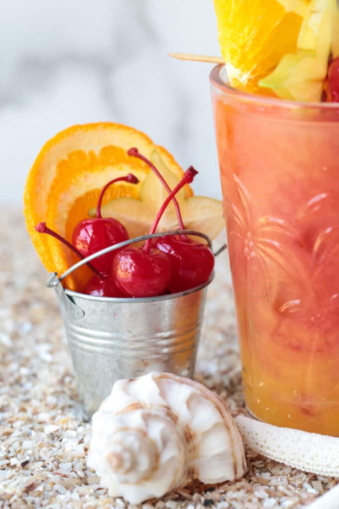 Maraschino cherries and orange slices to garnish sex on the beach drink