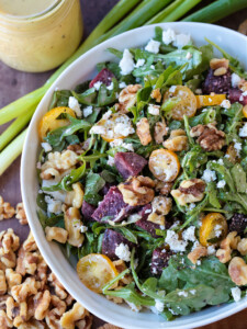 arugula salad with creamy maple dressing in a bowl