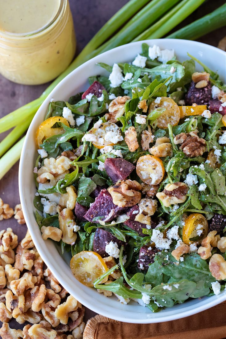 arugula salad with creamy maple dressing in a bowl