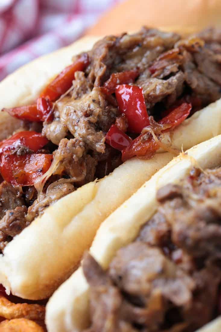 close up of ribeye steak sandwich with peppers