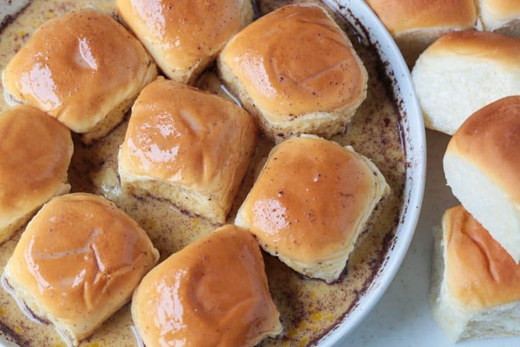 hawaiian rolls soaking in eggs and milk to make french toast