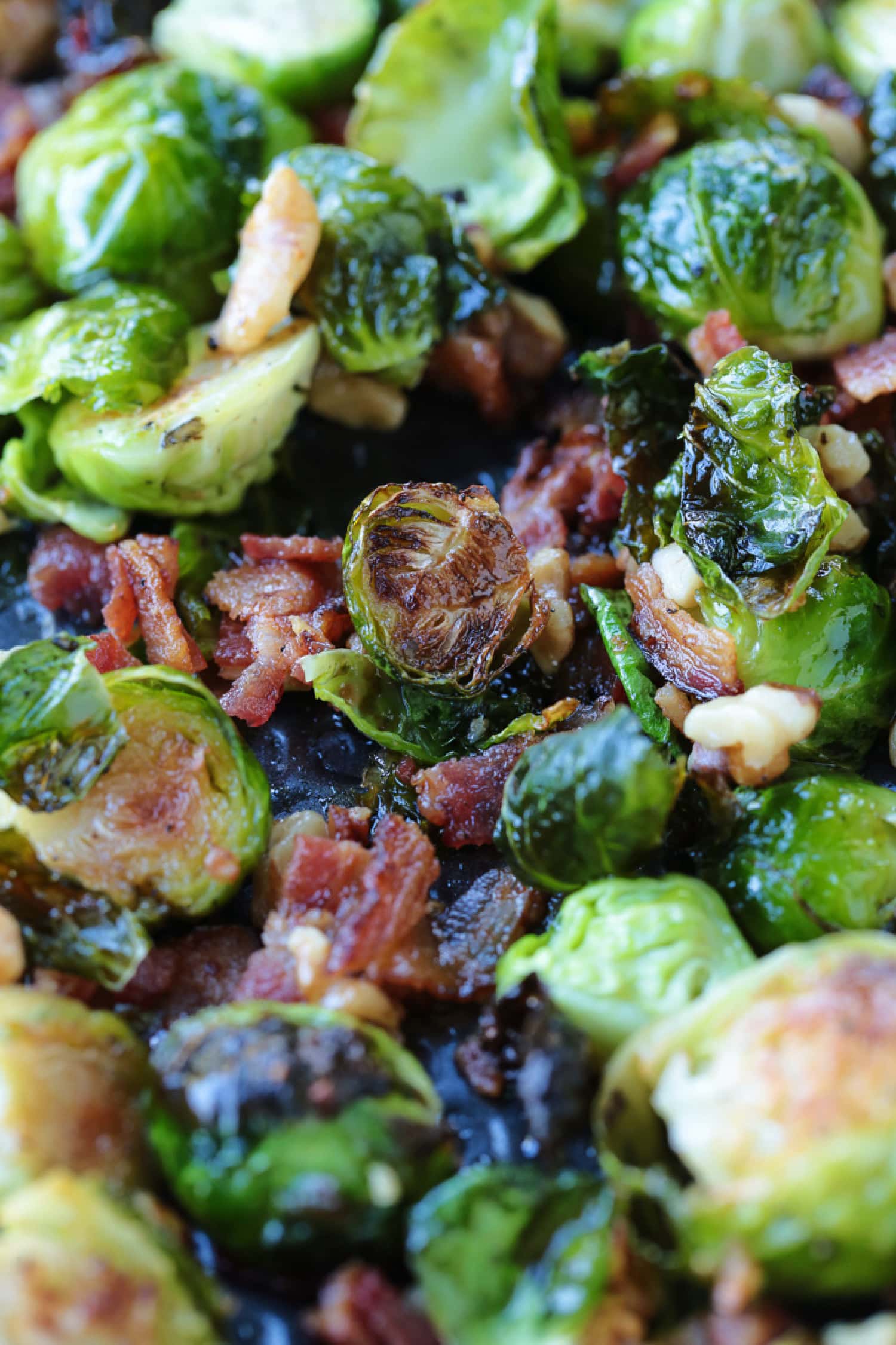 These Maple Bacon Brussels Sprouts have the perfect balance of sweet and salty! An easy to make, one pan vegetable side dish! roasted brussels sprouts with bacon