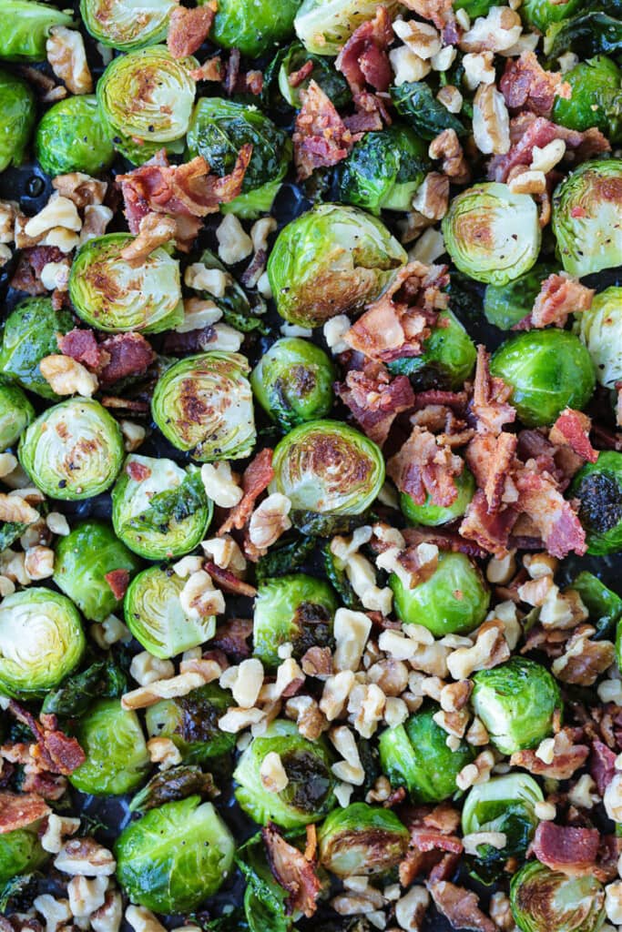 These Maple Bacon Brussels Sprouts have the perfect balance of sweet and salty! An easy to make, one pan vegetable side dish! Brussels sprouts with walnuts, bacon and maple glaze