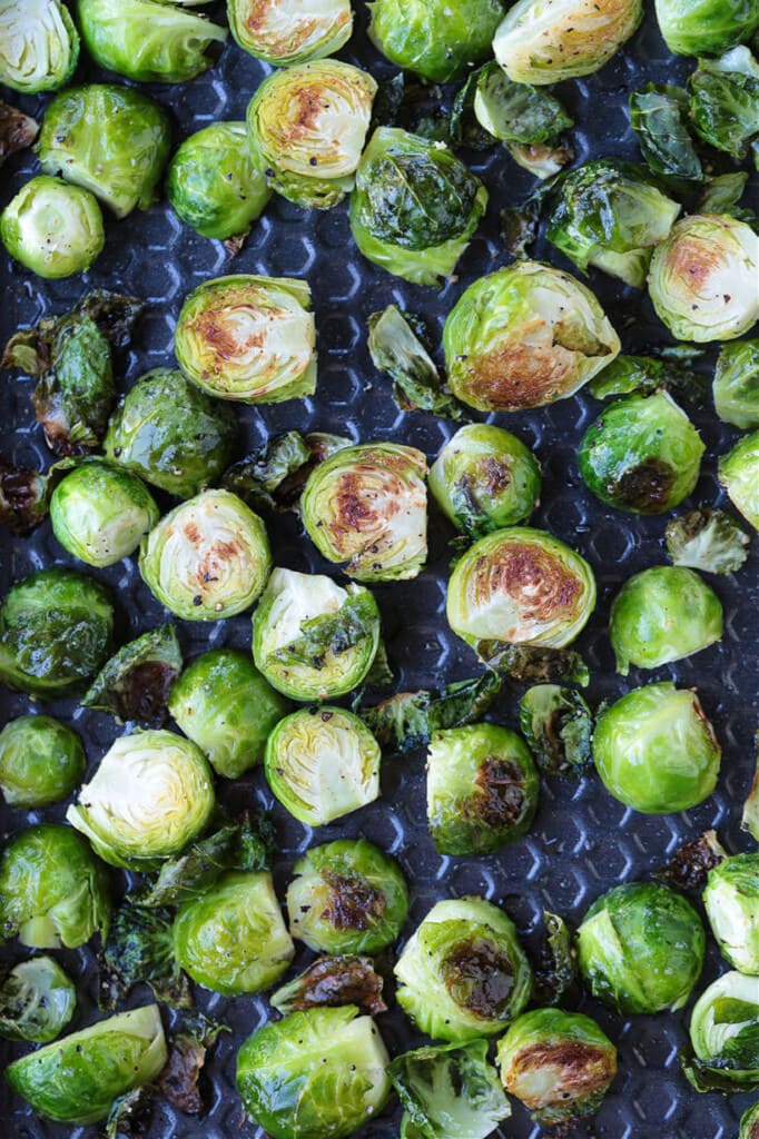 These Maple Bacon Brussels Sprouts have the perfect balance of sweet and salty! An easy to make, one pan vegetable side dish! roasted brussels sprouts on a sheet pan