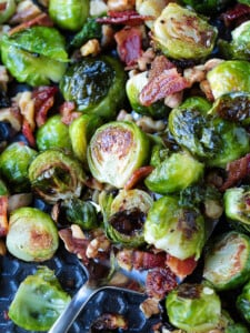 brussels sprouts with bacon and walnuts on a sheet pan