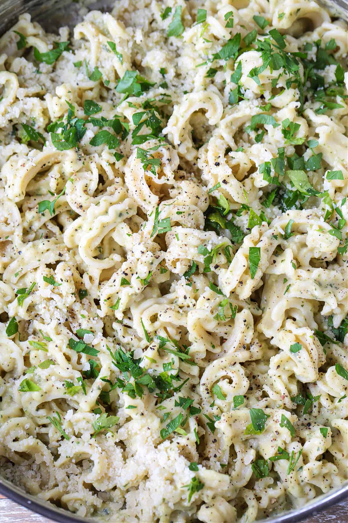 Zucchini Pasta Sauce can be used with any pasta shape, even in lasagna! Fresh and creamy and packed with tons of fresh zucchini flavor! pasta with parmesan cheese and parsley