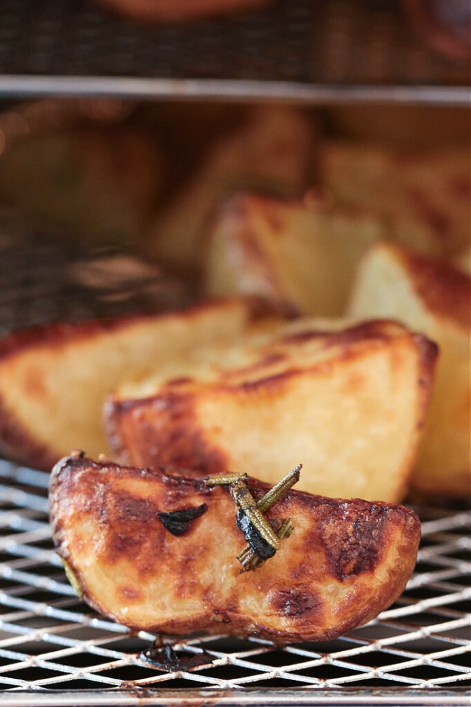 crispy potatoes in an air fryer with rosemary