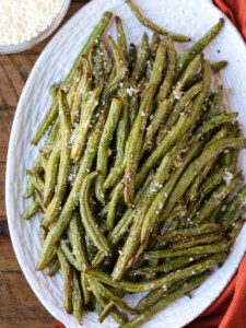 green beans on a platter with napkin on the side