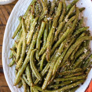 green beans on a platter with napkin on the side