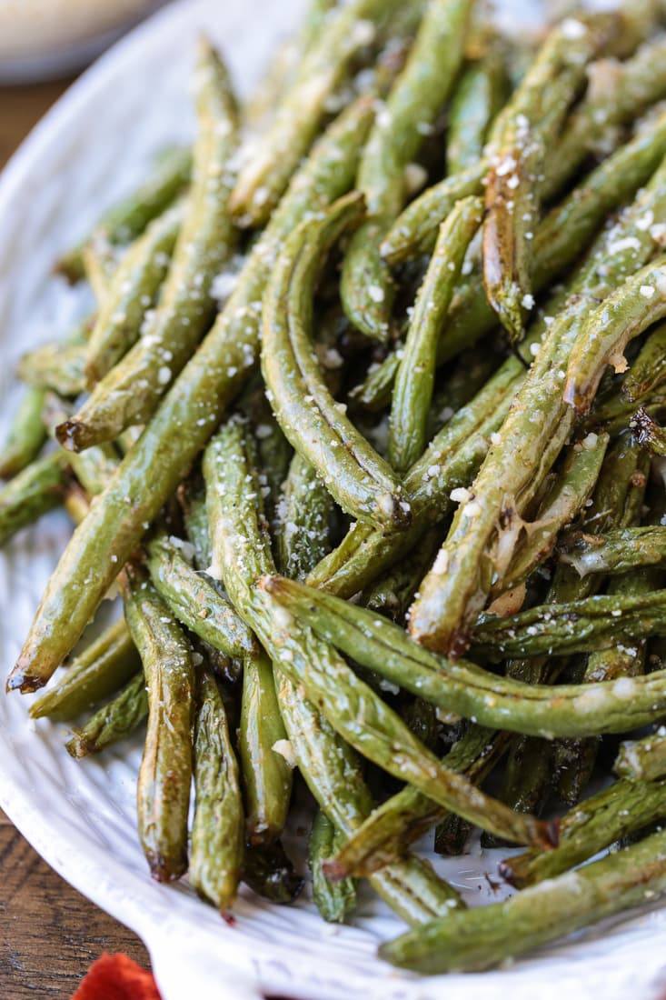 green beans on a platter with parmesan cheese