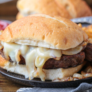 meatloaf sandwich with cheese on a plate with fries