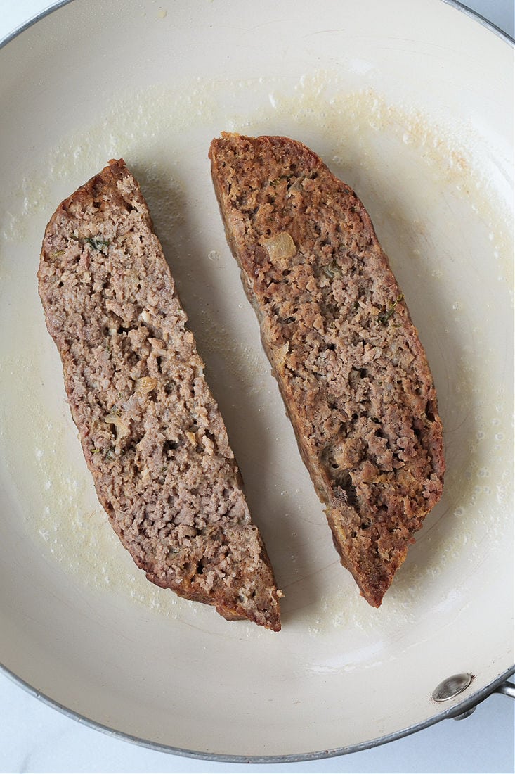 slices of meatloaf in a skillet