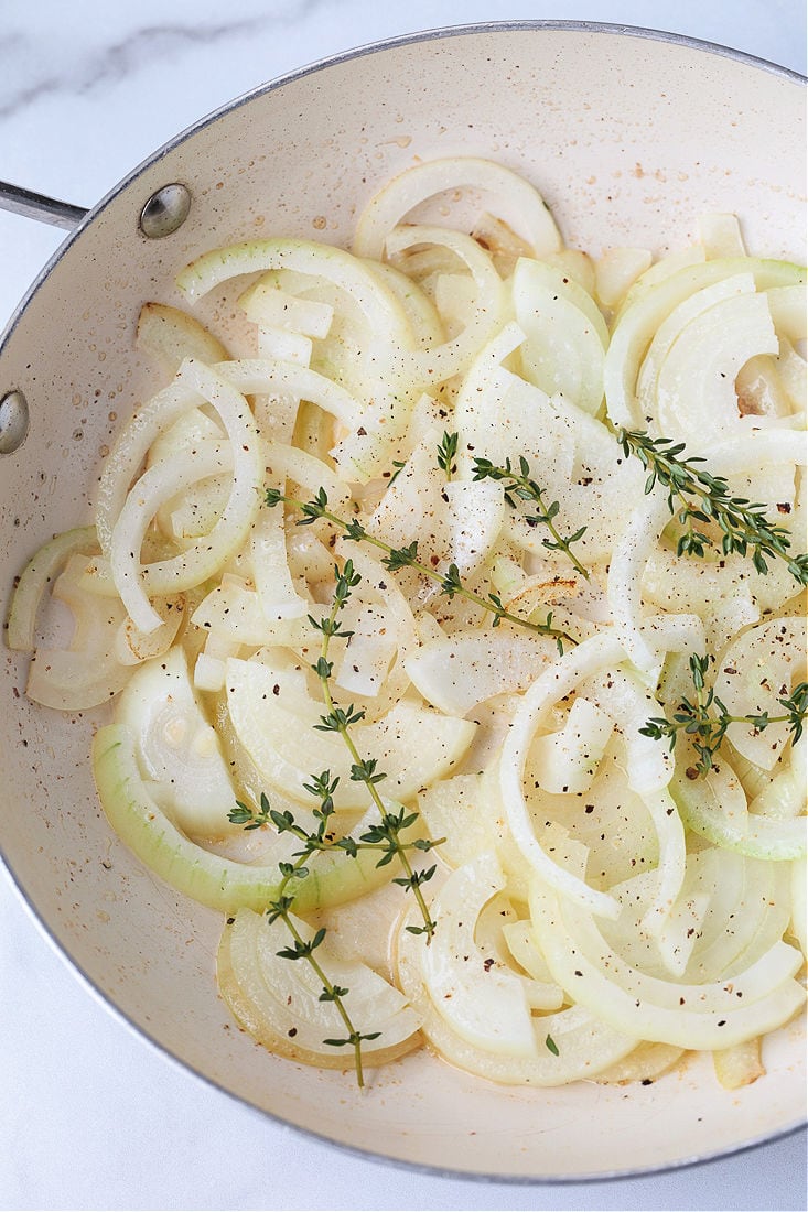 onions and thyme in a skillet