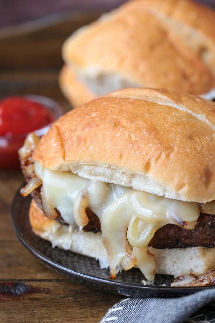 meatloaf sandwich with cheese on a plate with fries