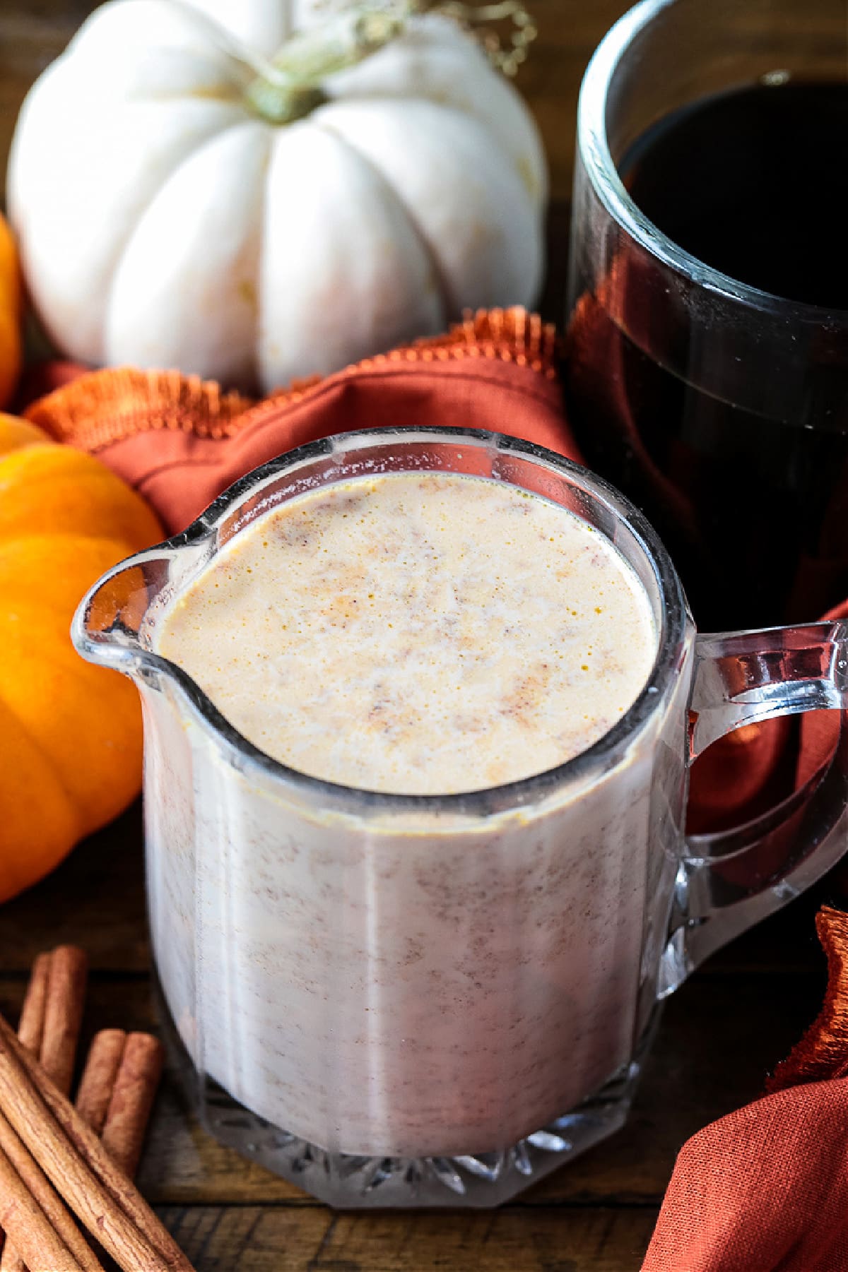 pumpkin spice creamer in pitcher with pumpkins